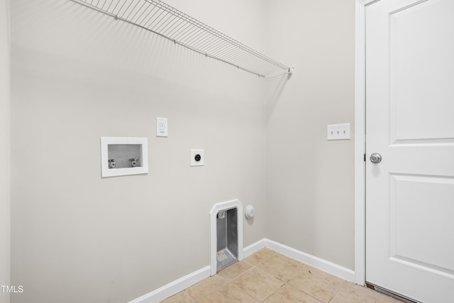 laundry area featuring washer hookup, laundry area, baseboards, electric dryer hookup, and light tile patterned floors