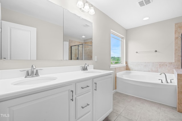 bathroom with visible vents, a sink, tile patterned flooring, and a stall shower