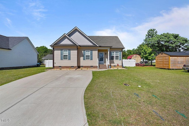 608 W Godwin St, Dunn, NC 28334 - view of front of home featuring board and batten siding, crawl space, driveway, and a front yard