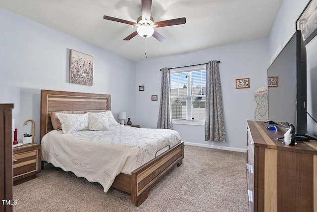 608 W Godwin St, Dunn, NC 28334 - carpeted bedroom with baseboards and ceiling fan