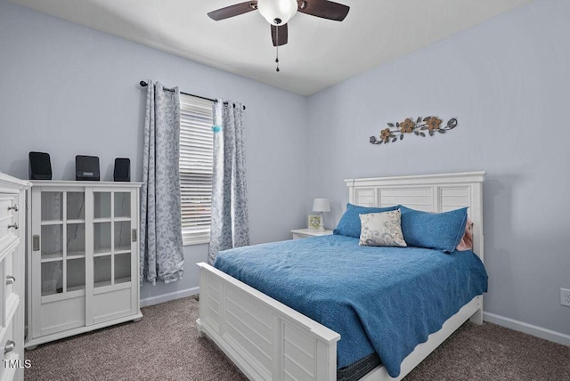 608 W Godwin St, Dunn, NC 28334 - carpeted bedroom featuring baseboards and a ceiling fan
