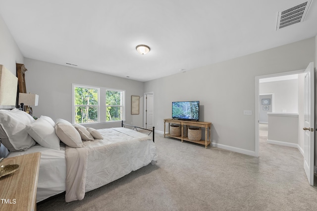 bedroom with baseboards, carpet, and visible vents