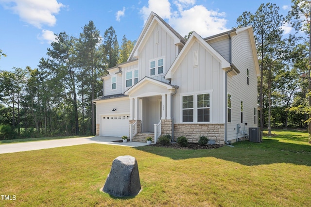 craftsman-style house with a garage, central AC, stone siding, board and batten siding, and driveway