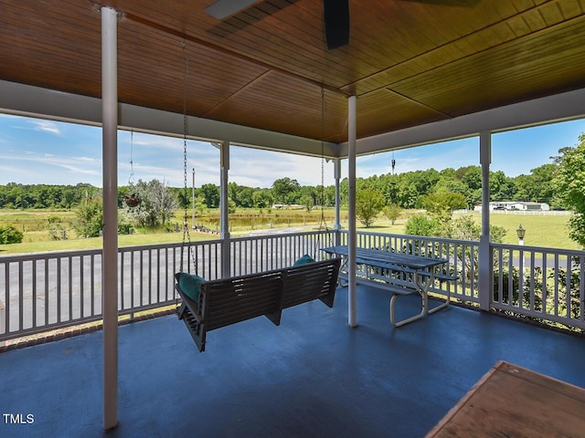 2371 NC-210, Smithfield, NC 27577 - unfurnished sunroom with view of scattered trees and a water view