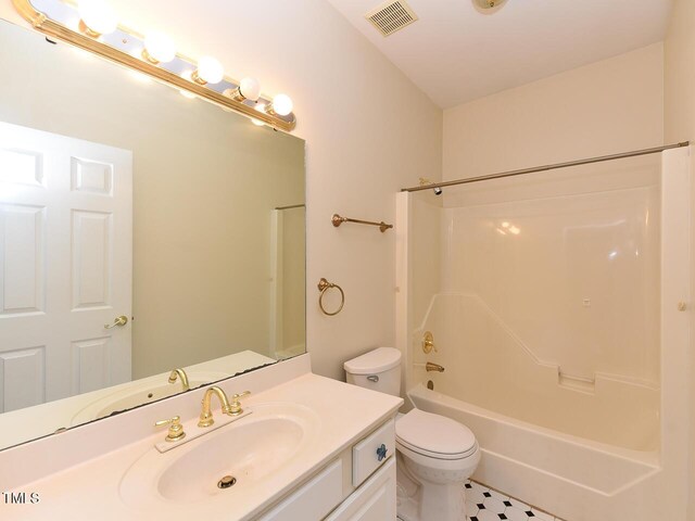 2371 NC-210, Smithfield, NC 27577 - bathroom featuring vanity, shower / bathtub combination, and toilet