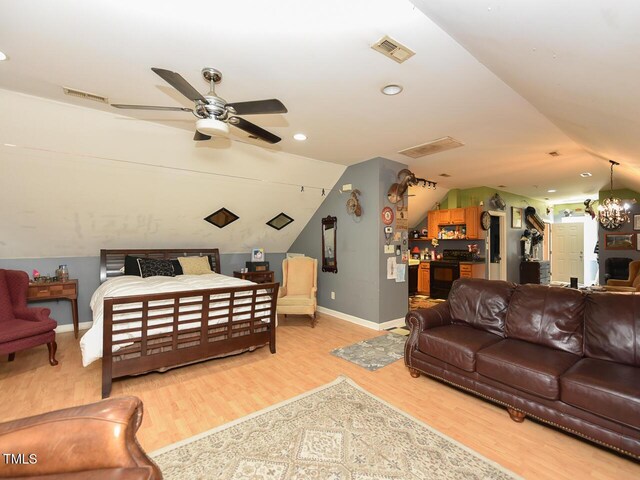 2371 NC-210, Smithfield, NC 27577 - bedroom with lofted ceiling, light wood-style flooring, baseboards, a chandelier, and recessed lighting