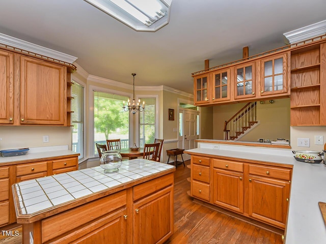 2371 NC-210, Smithfield, NC 27577 - kitchen featuring open shelves, tile countertops, crown molding, dark wood-style flooring, and a chandelier