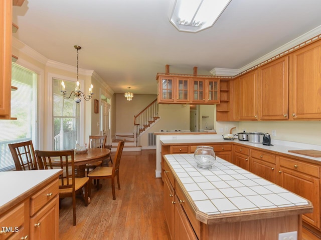 2371 NC-210, Smithfield, NC 27577 - kitchen featuring tile counters, a chandelier, light wood-type flooring, a peninsula, and open shelves