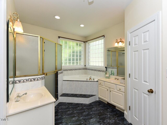2371 NC-210, Smithfield, NC 27577 - bathroom featuring two vanities, a garden tub, a shower stall, and recessed lighting