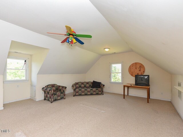 2371 NC-210, Smithfield, NC 27577 - living area featuring carpet floors, ceiling fan, vaulted ceiling, and baseboards