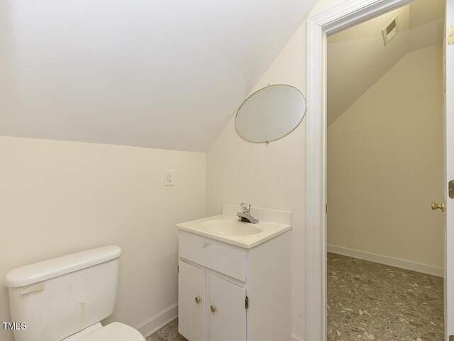 2371 NC-210, Smithfield, NC 27577 - half bath featuring vanity, vaulted ceiling, toilet, and baseboards