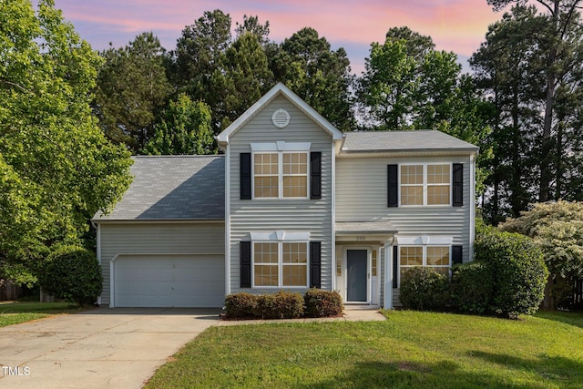 203 Downing Bluff Dr, Morrisville, NC 27560 - view of front facade featuring an attached garage, driveway, and a front yard