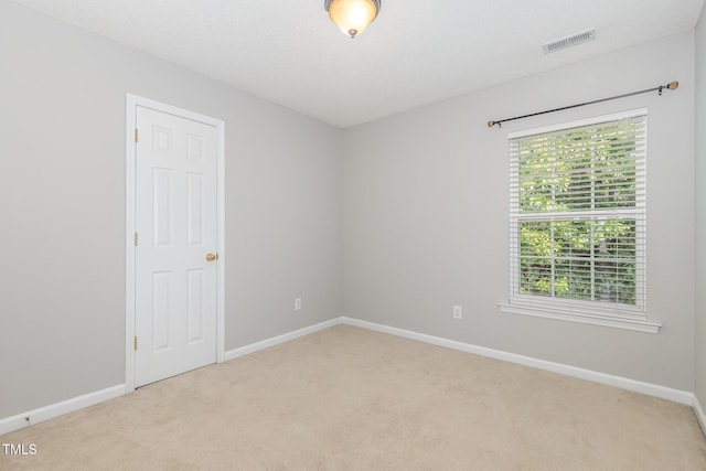 203 Downing Bluff Dr, Morrisville, NC 27560 - empty room featuring visible vents, baseboards, and light carpet