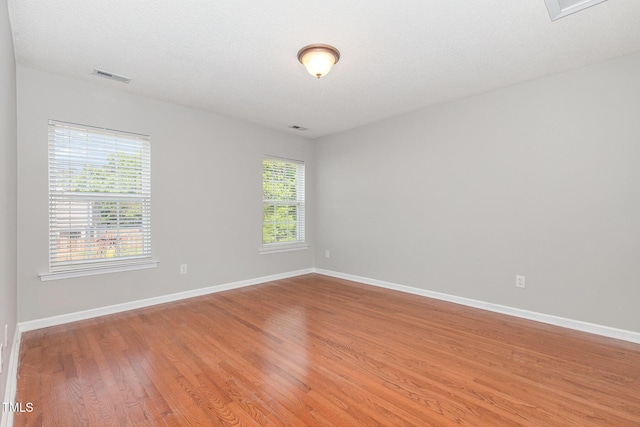 203 Downing Bluff Dr, Morrisville, NC 27560 - unfurnished room with light wood-style floors, baseboards, and visible vents
