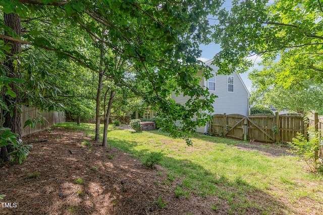 203 Downing Bluff Dr, Morrisville, NC 27560 - view of yard with a fenced backyard and a gate