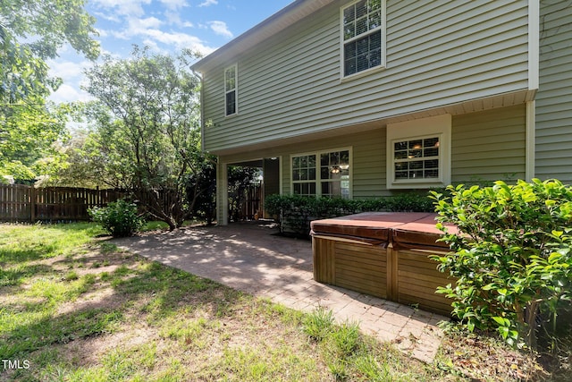 203 Downing Bluff Dr, Morrisville, NC 27560 - rear view of property featuring a hot tub, fence, and a patio area