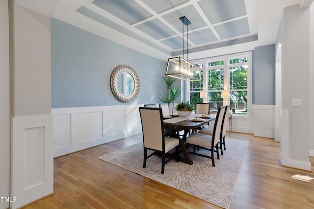 211 Page St, Morrisville, NC 27560 - dining space with a decorative wall, wainscoting, wood finished floors, and coffered ceiling
