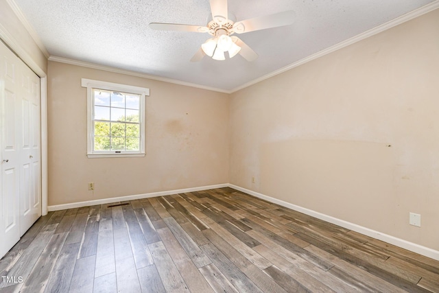 spare room with baseboards, wood-type flooring, and a ceiling fan