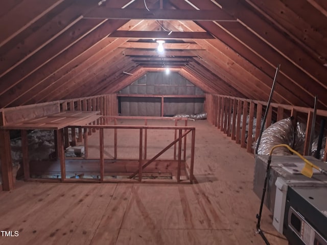 unfinished attic featuring an upstairs landing