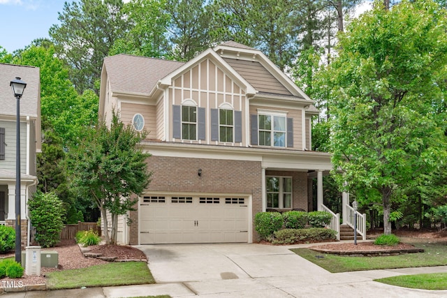 3304 Rockland Ridge Dr, Cary, NC 27519 - view of front of house with a garage, driveway, covered porch, and brick siding
