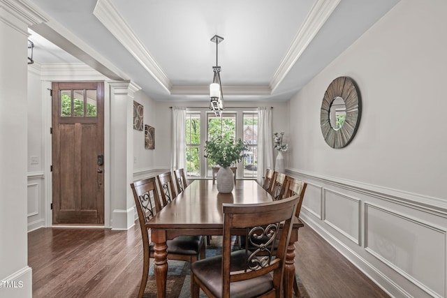 3304 Rockland Ridge Dr, Cary, NC 27519 - dining room featuring dark wood-style floors, ornamental molding, a decorative wall, a tray ceiling, and wainscoting