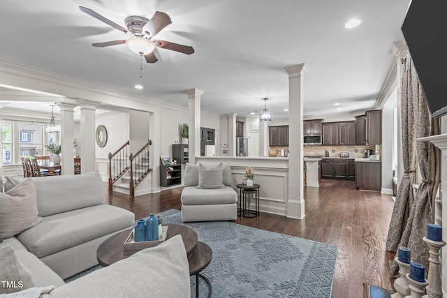 3304 Rockland Ridge Dr, Cary, NC 27519 - living area featuring ornate columns, ceiling fan, stairs, recessed lighting, and crown molding