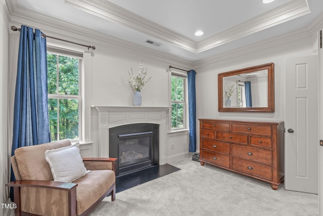 3304 Rockland Ridge Dr, Cary, NC 27519 - living area with plenty of natural light, light carpet, crown molding, a fireplace with flush hearth, and baseboards