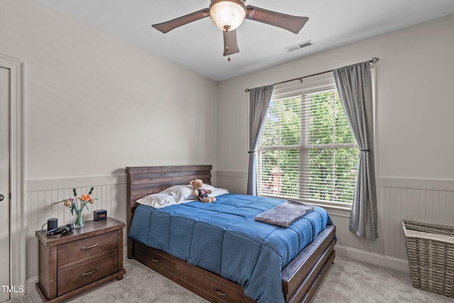 3304 Rockland Ridge Dr, Cary, NC 27519 - carpeted bedroom featuring wainscoting, a ceiling fan, and wood walls
