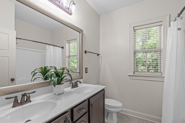 3304 Rockland Ridge Dr, Cary, NC 27519 - full bathroom featuring toilet, tile patterned floors, double vanity, and curtained shower