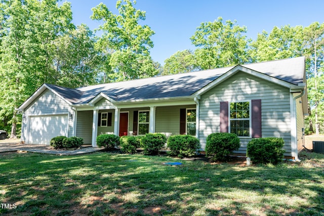 ranch-style house featuring covered porch, cooling unit, a front yard, and a garage