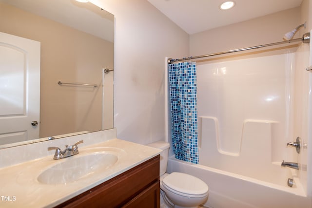 bathroom with recessed lighting, vanity, toilet, and shower / tub combo