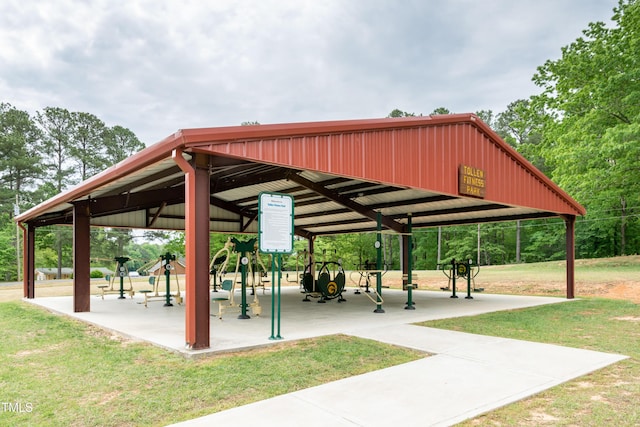 view of property's community with a lawn and playground community