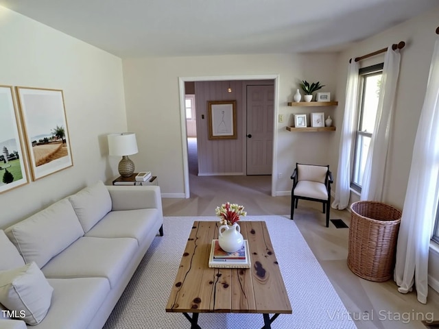 4908 Mandel Rd, Durham, NC 27712 - living area featuring baseboards and light colored carpet