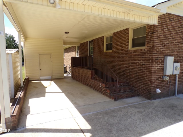 4908 Mandel Rd, Durham, NC 27712 - view of patio / terrace with a carport and concrete driveway