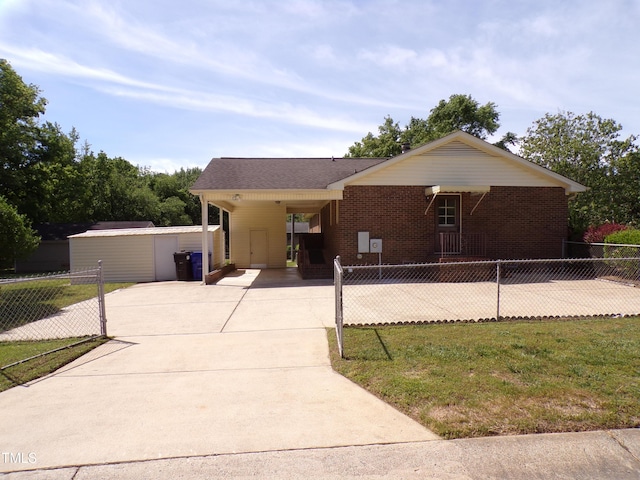 4908 Mandel Rd, Durham, NC 27712 - single story home with driveway, an attached carport, and brick siding