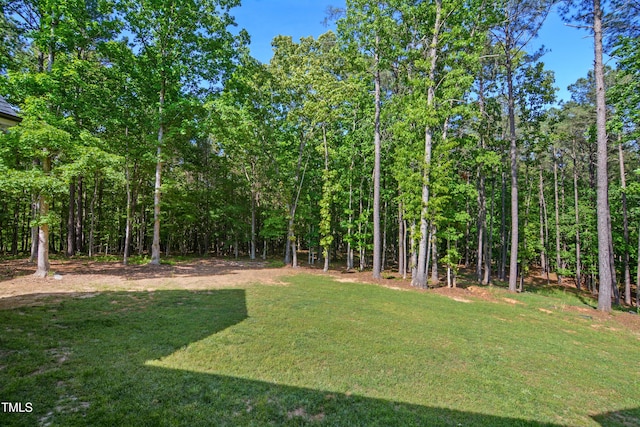 view of yard featuring a view of trees