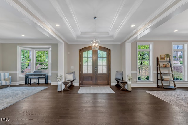 entryway with french doors, dark wood-style flooring, baseboards, an inviting chandelier, and a tray ceiling