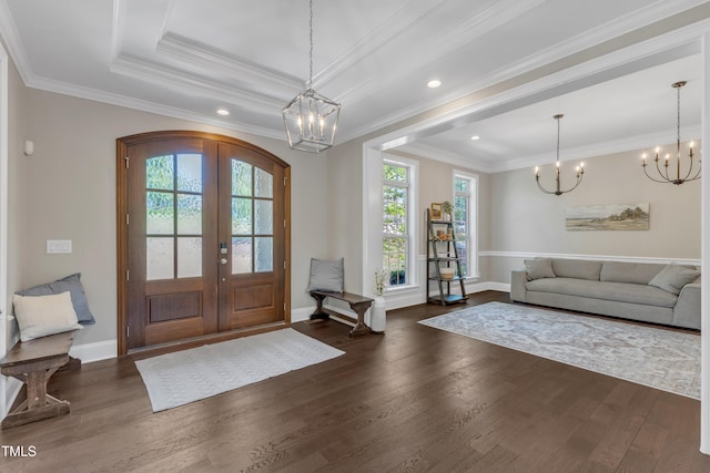 entrance foyer featuring baseboards, french doors, dark wood finished floors, and a chandelier