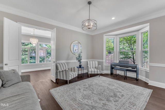 sitting room with dark wood-style flooring, baseboards, and a notable chandelier