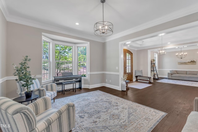 living room featuring baseboards, dark wood finished floors, and a notable chandelier