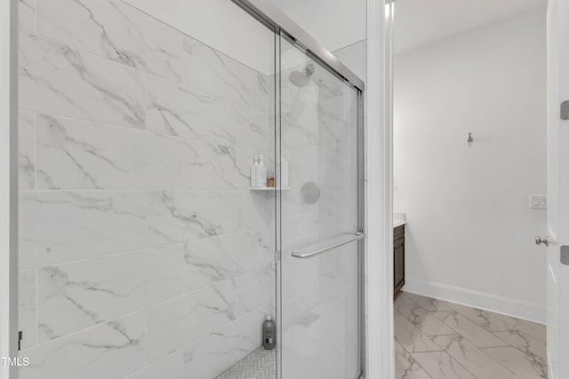 bathroom with baseboards, a shower stall, marble finish floor, and vanity