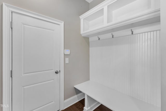 mudroom with baseboards and dark wood finished floors
