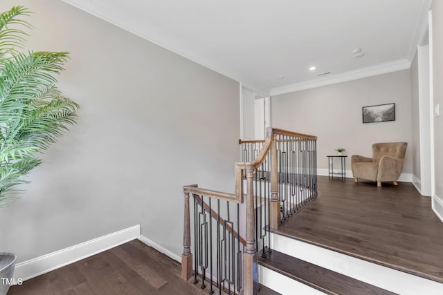 stairway with crown molding, recessed lighting, baseboards, wood finished floors, and visible vents