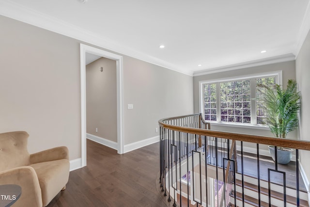 corridor with crown molding, baseboards, dark wood-style floors, an upstairs landing, and recessed lighting
