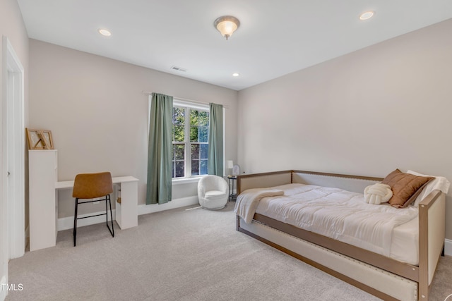carpeted bedroom featuring recessed lighting, baseboards, and visible vents