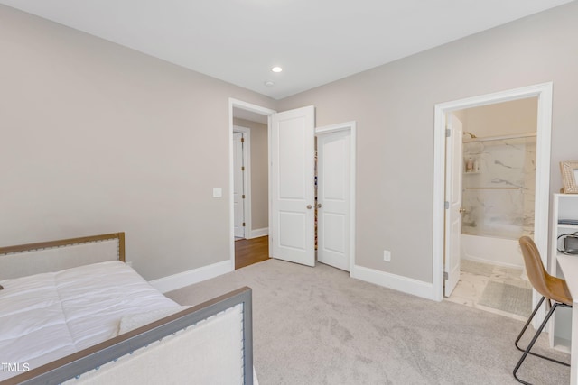 bedroom with baseboards, carpet flooring, ensuite bathroom, and recessed lighting