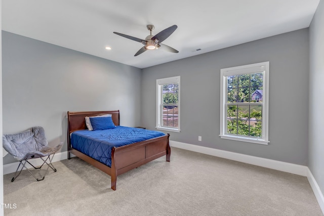 bedroom with baseboards, ceiling fan, and carpet flooring
