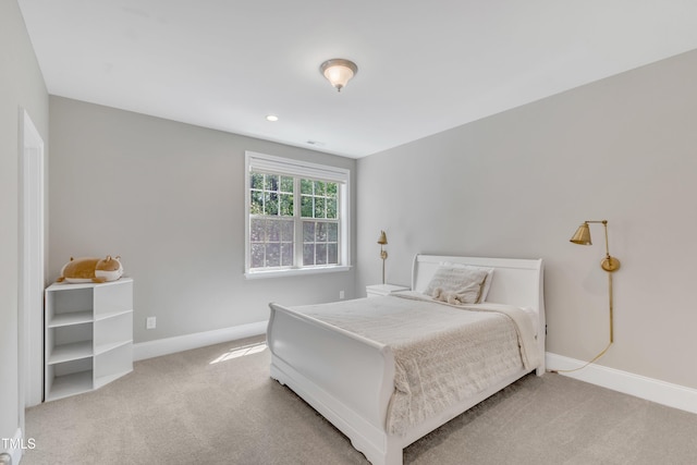 bedroom with carpet floors and baseboards