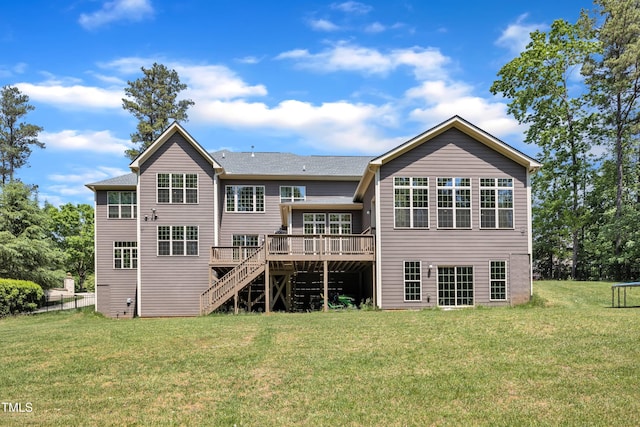 back of house with a deck, a yard, and stairway
