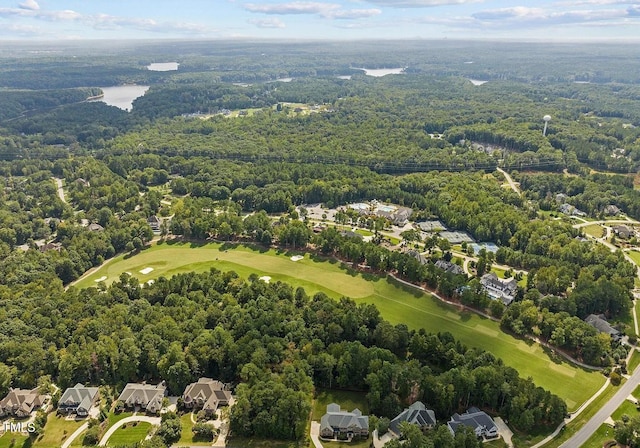 bird's eye view with a view of trees, a residential view, and golf course view